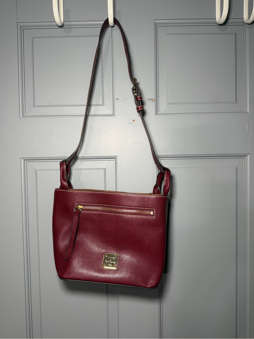 Dooney & Bourke Burgundy Pebbled Leather drawstring Crossbody